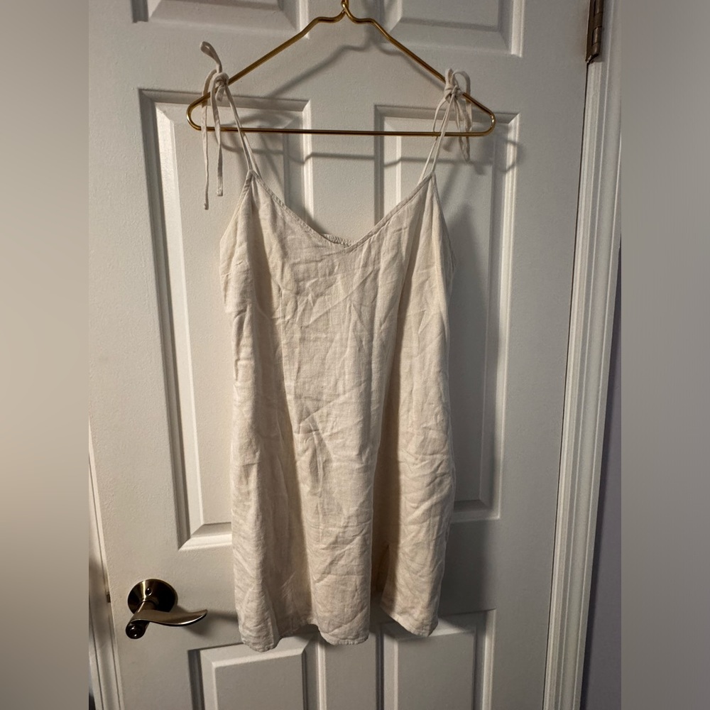 White tie dress with small cut out at bottom